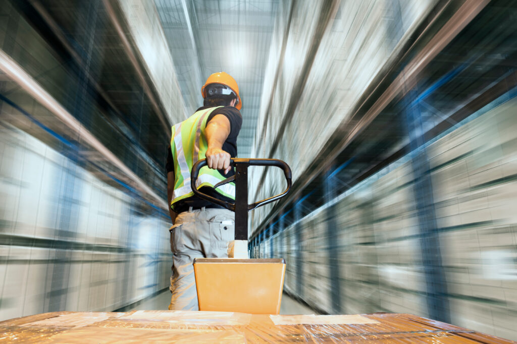 Man moving pallet truck speedily 