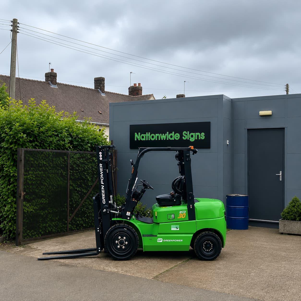 Greenpower forklift parked in front of Nationwide Signs logo and building