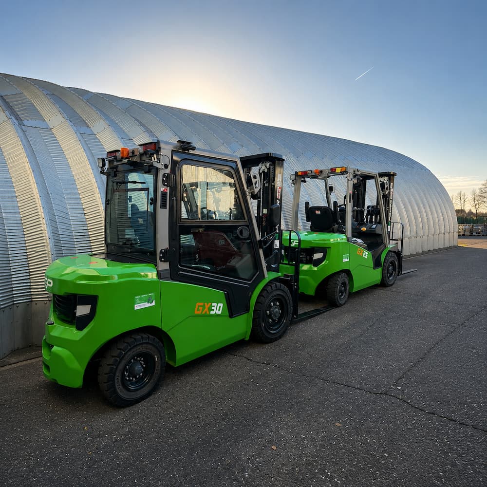 Two Greenpower forklifts parked on industrial estate